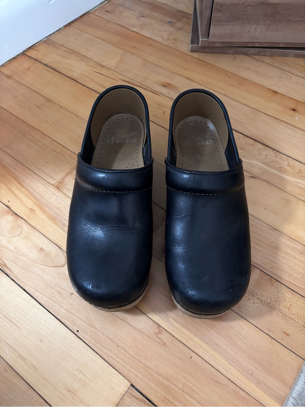 Dansko Black Leather Women's Slip-On Clogs
